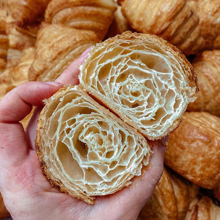 A cross section of the inside of a flaky vegan croissant